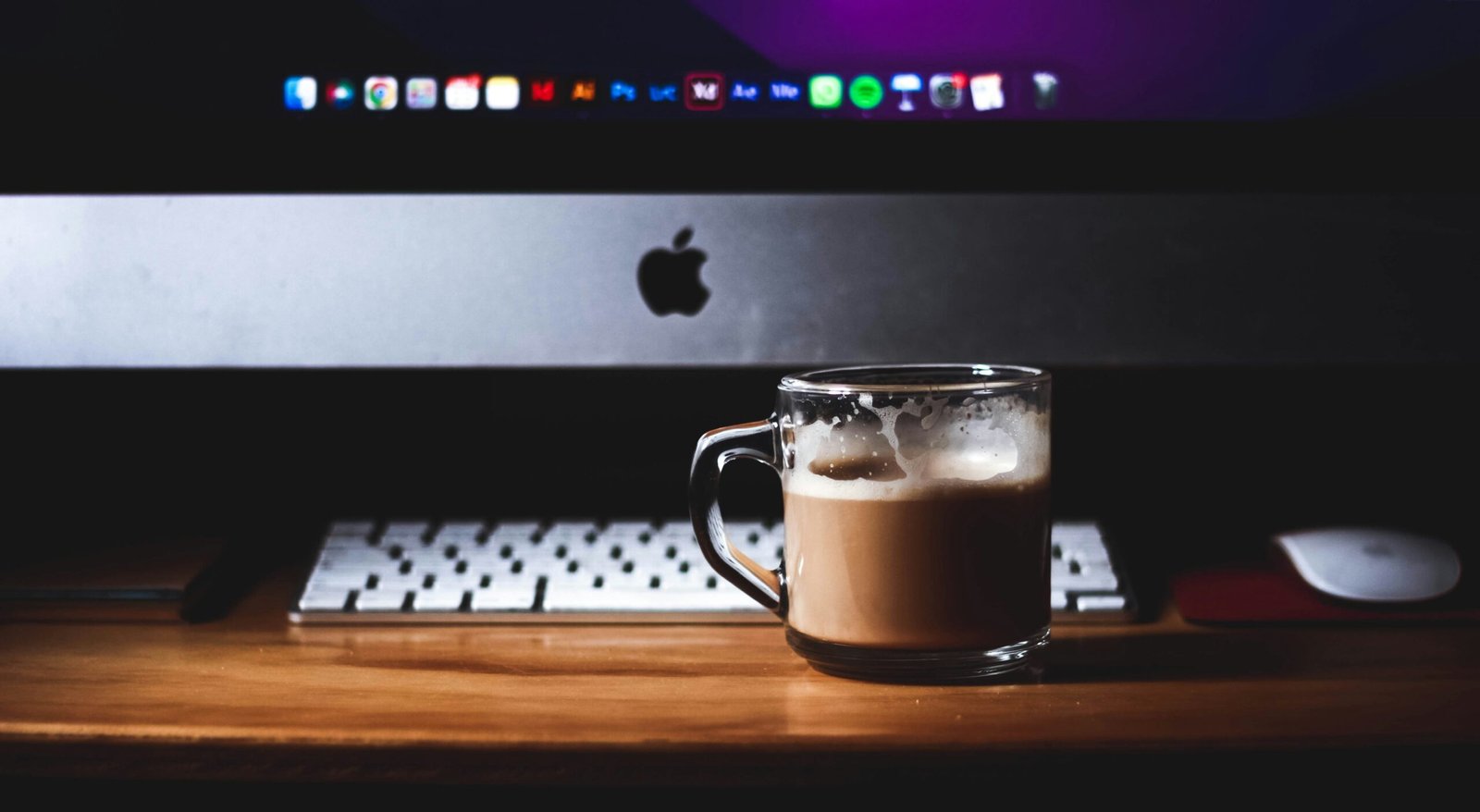 a cup of coffee sitting on top of a wooden table